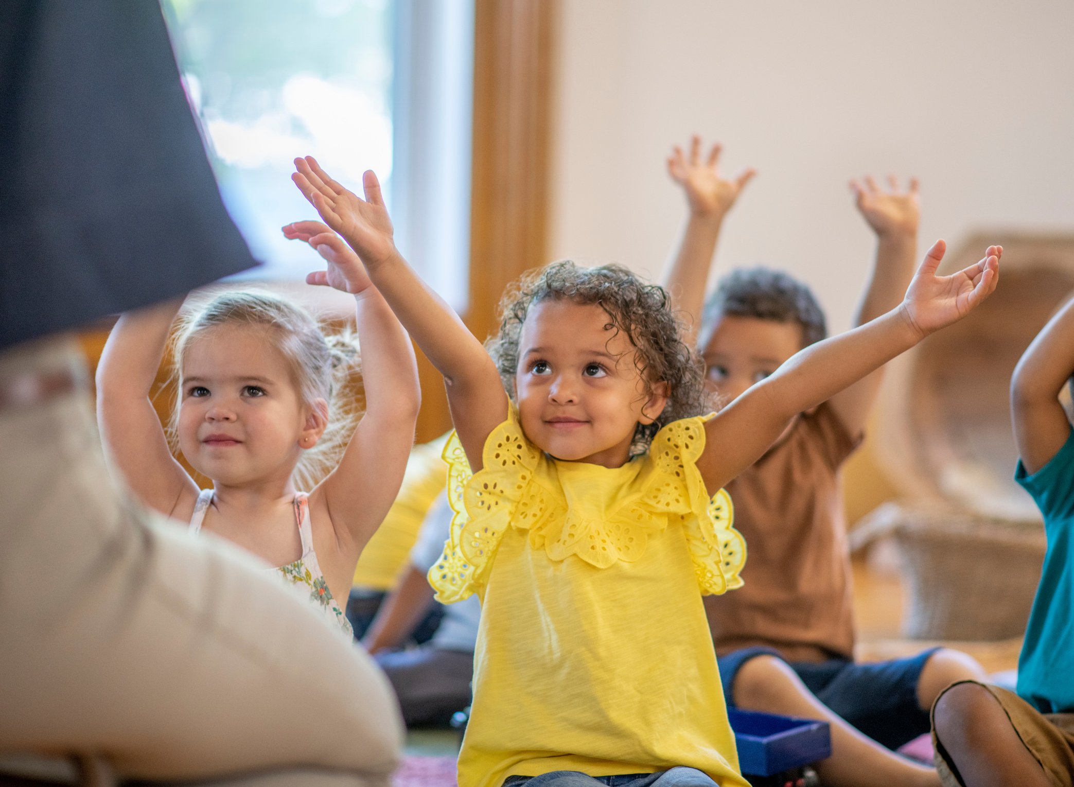 Preschool kids doing yoga